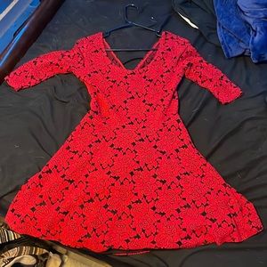 Red dress with flowers. Doesnt have the tags on it.